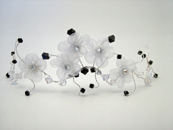 White organza flower, black crystal hair vine.Atten: Courtney